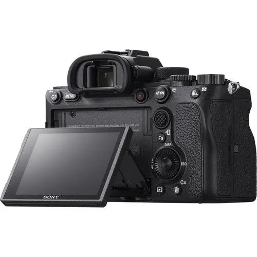 Sony Alpha 7R IV with its rear LCD screen tilted outward, showing the flexible articulation for high and low-angle shooting.